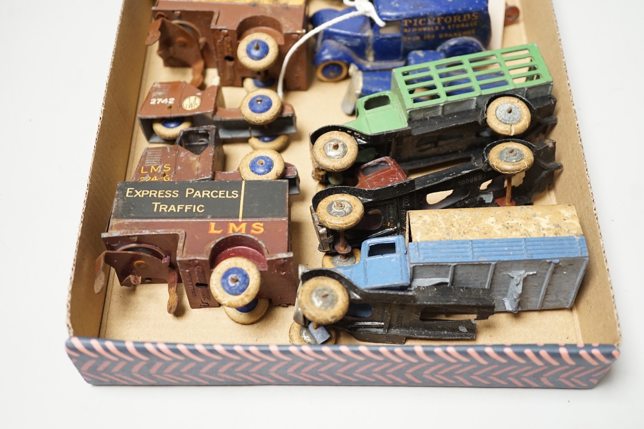 Rare pre-war Dinky toys including two 28-series, second-type delivery vans, Pickfords and Manchester Guardian